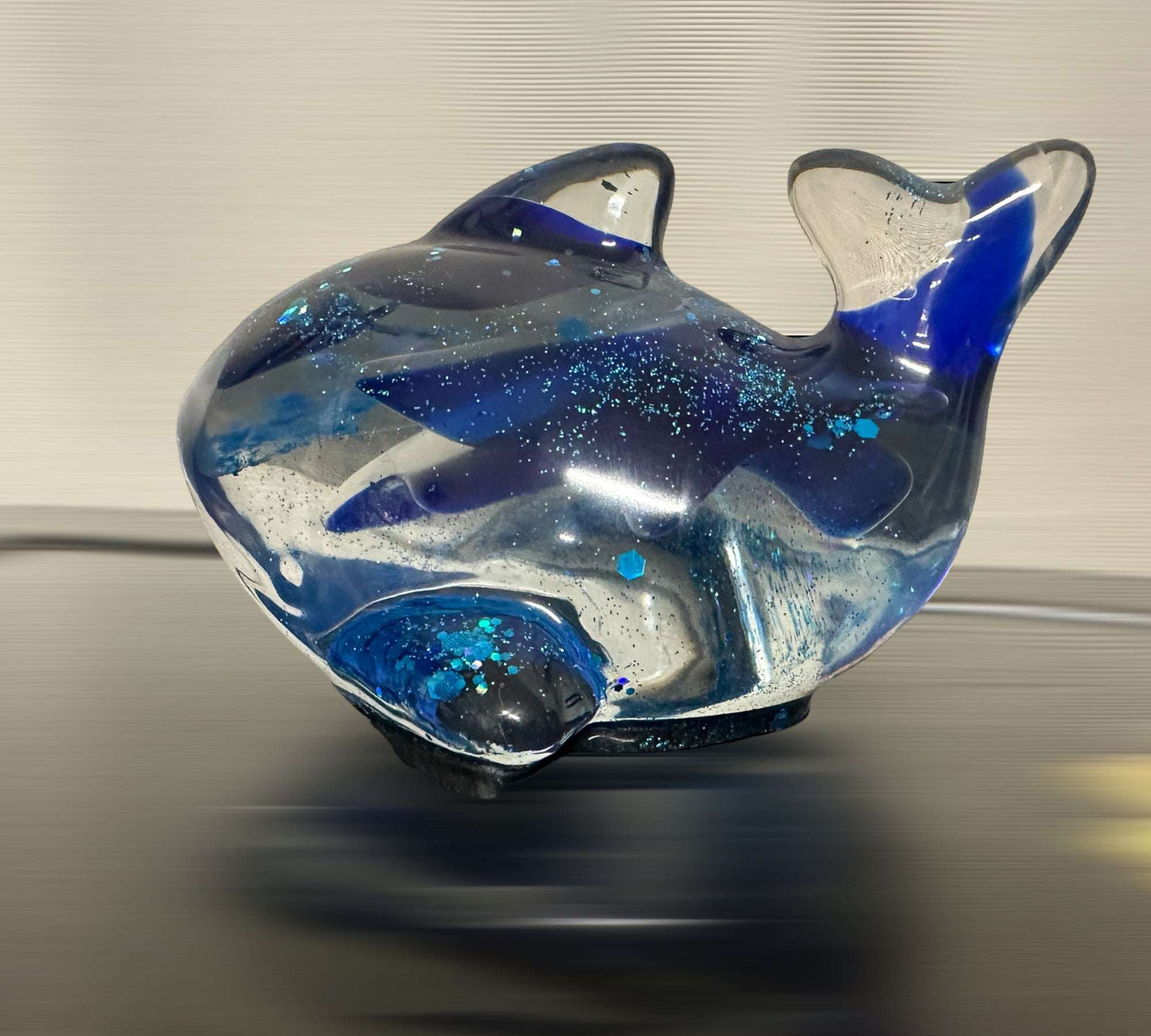 An Epoxy Resin Whale Sculpture filled with sea glass for Nature Lovers 